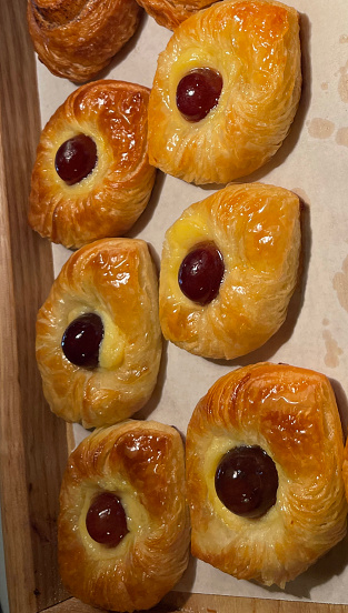 freshly baked Danish pastry with apricot jam fruity jelly super delicious warm fresh buttery baked pastries with apricot and peach