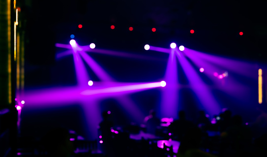 Abstract blurred image background of stage with colorful lights. Party, concert and entertainment concept