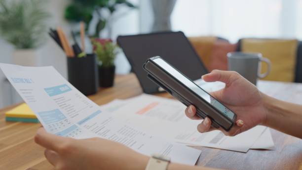 istock Close up hands woman holding smartphone scan QR code for make online utility bill payment,contactless Internet banking  technology and money transfer 2085469579