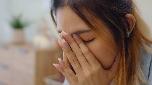 istock Close up Struggle woman having financial problems paychecks paper receipt bill statement ,calculating on smartphone for monthly expenses debt,planning budgets of monthly personal balance at home. 2085469592
