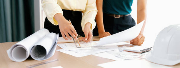 istock Professional architect used divider measure during draft blueprint. Delineation. 2085478987
