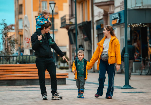 Young family walking down the street.
