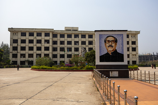 Noakhali, Bangladesh - 4 March 2024 - Noakhali Science and Technology University (NSTU) Administrative Building with Bangabandhu Sheikh Mujibur Rahman Mural. It is a public university.