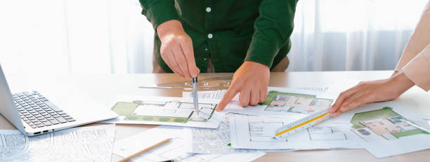 istock Professional engineer using divider to measure blueprint. Closeup. Delineation. 2085505056