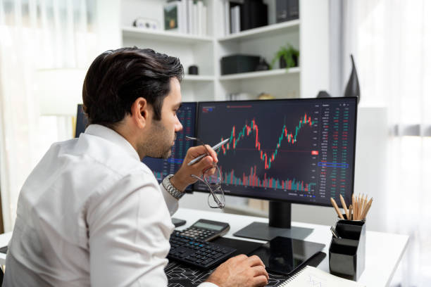 istock Trader analyzing in dynamic stock exchange investment screen on pc. Surmise. 2085526935
