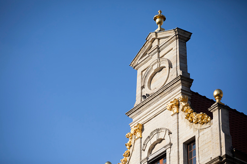 Rosa Khutor, Sochi, Russia, 11.01.2021. Town hall with a clock in a mountain village. Olympic town on the banks of the mountain river Mzymta in autumn