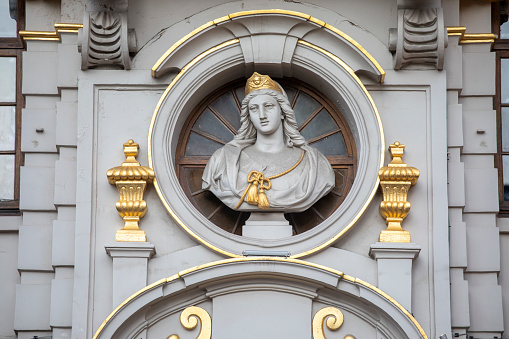 France. Haute-Savoie. St. Nicholas of Veroce / St. Gervais-les-Bains. April, 30, 2019. This colorful image depicts painting (Unknown author): Saint-Martin, bishop of Tours in the fourth century (details), sur l'autel baroque latéral gauche of the church St. Nicolas de Véroce buit in 1725.