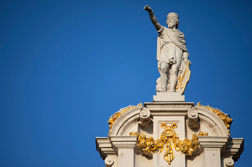 Boadicea and Her Daughters bronze statue at the Westminster Bridge under plane trails in the sky