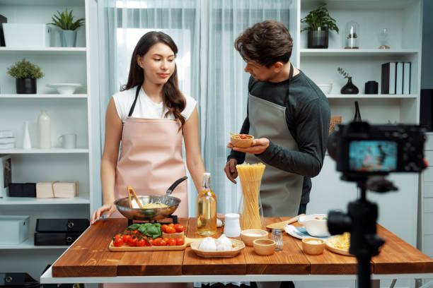 istock Influencers on cooking show presenting ingredient of spaghetti dish. Postulate. 2085551930