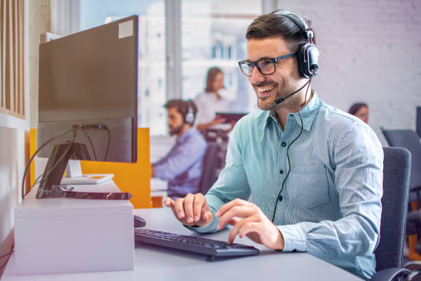 istock Friendly operator talking with client during phone call giving adequate answers to client and solving clients doubts. 2085581816