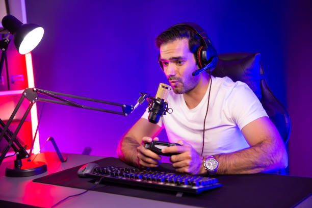 istock Streamer talking with team member players with joystick control game. Surmise. 2085581828