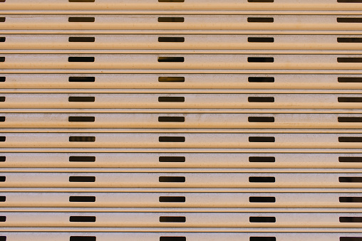 The walls are paneled in beige stripes. Background of city building elements.