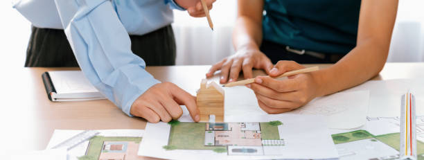 istock Professional architect plans to build eco house. Closeup. Delineation. 2085598229