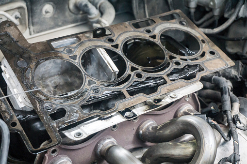 Close up view of damaged fossil fuel car engine