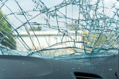 Broken car windshield vehicle interior view