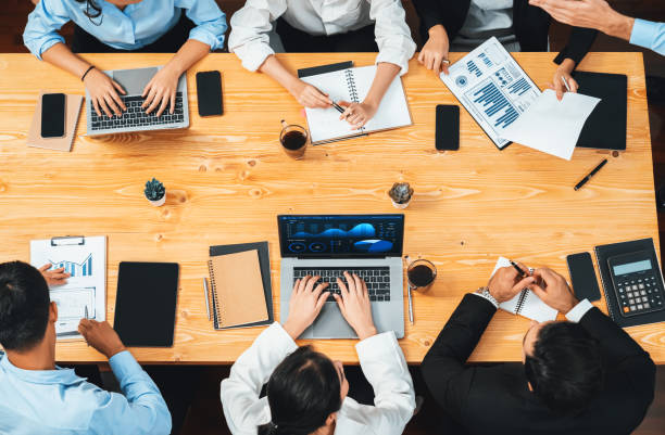 istock Panorama top view diverse analyst team analyzing financial data. Habiliment 2085611260