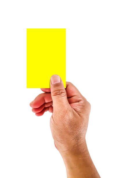 istock Hand holding and raising yellow card 2085614386