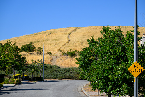 Hills covered with dried grass in summer. San Jose. California.