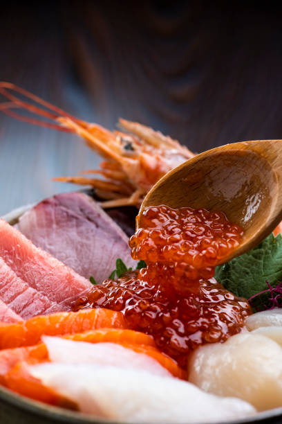 istock Placing Salmon Roe on Fresh Seafood Bowl 2085617001