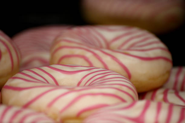 White donuts with pink lines on it