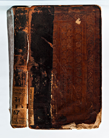 Turin, Piedmont, Italy - July 10, 2012: Old leather-bound book (detail of the cover).