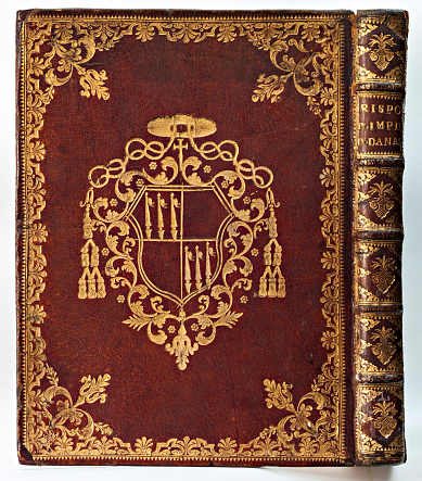 Turin, Piedmont, Italy - July 10, 2012: Old leather-bound book (with cover and spine gilded).