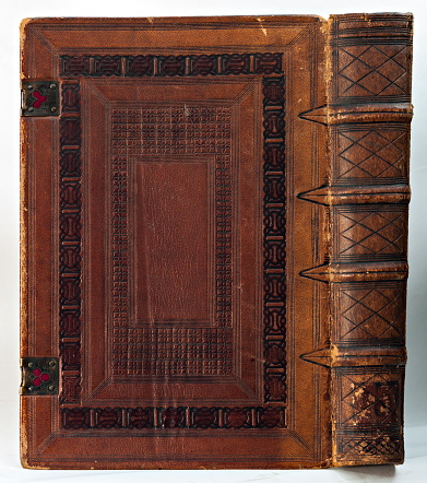 Turin, Piedmont, Italy - July 10, 2012: Old leather-bound book (detail of the cover and the spine).
