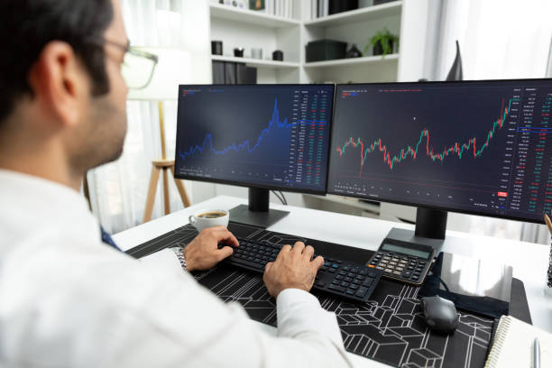istock Trader analyzing in dynamic stock exchange investment screen on pc. Surmise. 2085650065