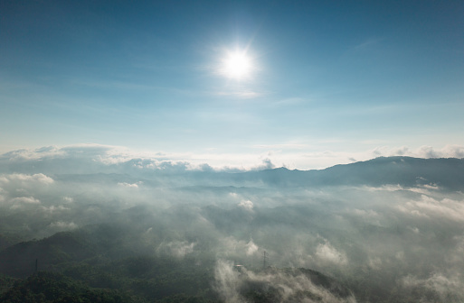 Drone aerial photography: Mae Moh District, Lampang Province, Thailand; high mountain scenery, misted in the morning.