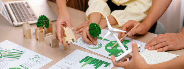 istock Windmill model placed during presenting green business. Closeup. Delineation. 2085663051