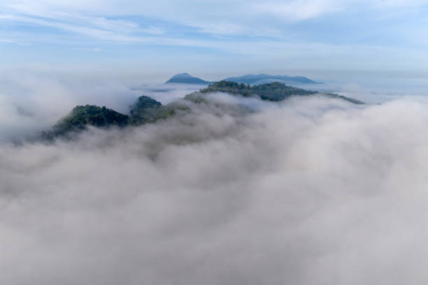 istock High mountain scenery, misted in the morning. 2085663622