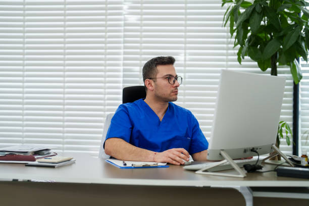 istock Healthcare worker using computer in the clinic office. 2085666413