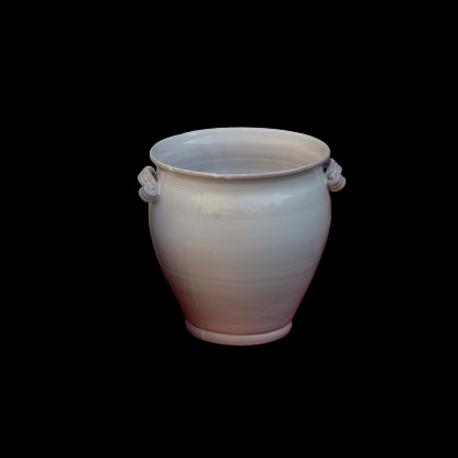 Vintage ceramic vase with handles and a smooth finish, displayed on a dark backdrop