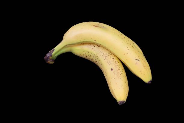 istock Ripe bananas on black background 2085669033
