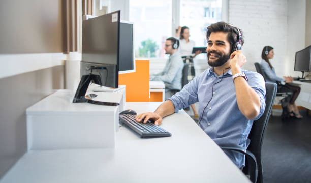 istock Male employee telephone worker assisting to client while having conversation during online phone call center. 2085679692