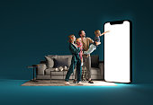 Family interacting with huge 3D model of smartphone in living room against blue background. Online shopping, delivery services, sales