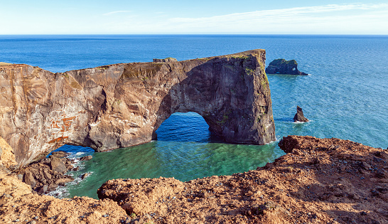 The arch of Dyrholaey on the Vico coast is a rock in Iceland that is sunny all day