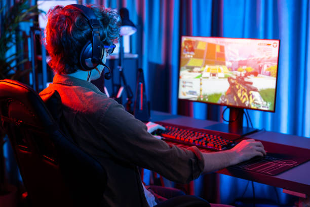 istock Gaming streamer team playing battle game shooting at back side image. Gusher. 2085740511