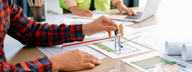 istock Cropped image of professional engineer team working on blueprint. Delineation. 2085765946
