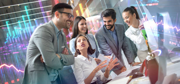 istock Diversity business team planning strategy gathered around computer desk. Business, technology and stock market concept. 2085766991