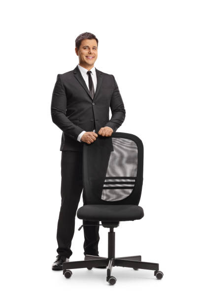 istock Businessman standing behind an office chair 2085788566