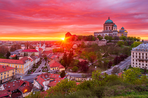 Sunset behind the basilica of Esztergom in Hungary, colourful rainy clouds above.