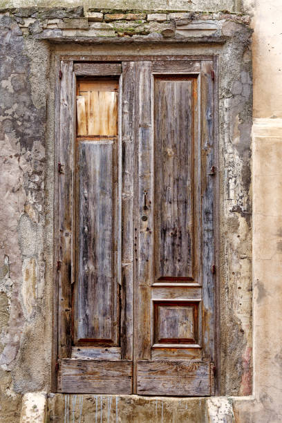 istock aged, worn and damaged wooden door 2085850276