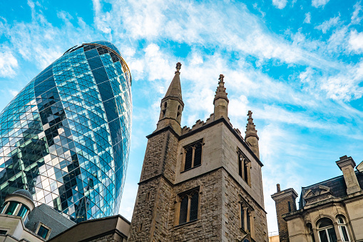 St Andrew Undershaft Church in front of modern skyscraper buildings background