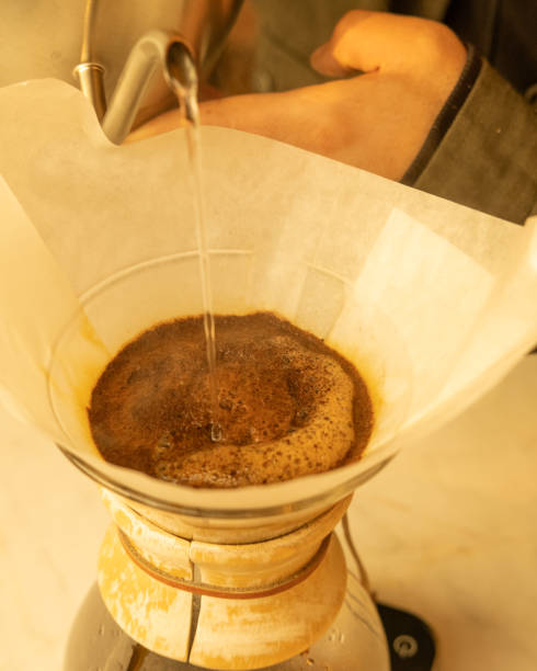 istock Closeup of Chemex Coffee pouring into a cup 2085854424