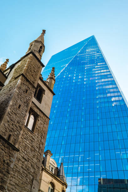 St Andrew Undershaft church and the Gherkin in the city of London.