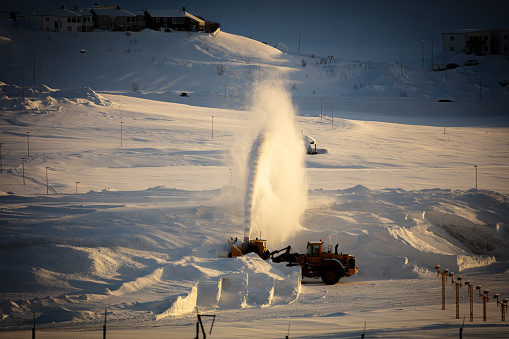 Snow blower vehicle is working on the snow.\nHammerfest - Norway.