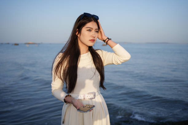 Beautiful girl standing on the beach