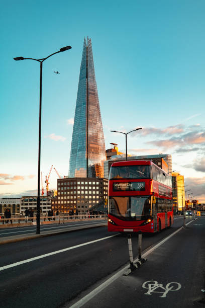 istock A red double-decker bus on Bridge in London with skyscrapers 2085896332