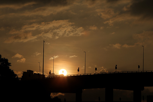 Sunset in city with focus on flyover